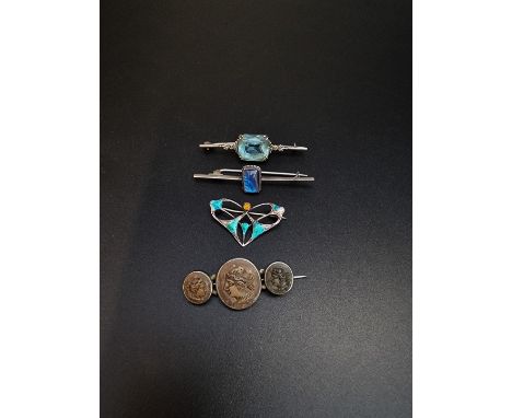 An Art Nouveau enamel brooch,&nbsp;by Charles Horner, Chester 1908, 32mm; together with three other brooches. (4) 