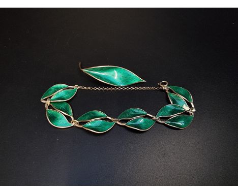 A vintage David Andersen green enamel leaf brooch, 65mm; together with matching bracelet, designed by Willy Winnaess, stamped