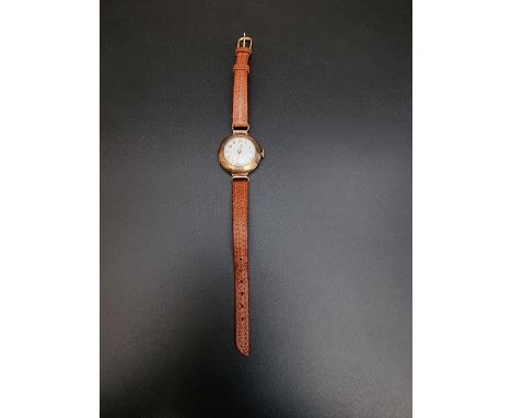 A 9ct gold manual wind ladies wristwatch, on brown leather strap. 