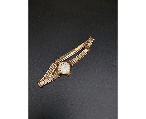 An Excalibur 9ct gold manual wind ladies wristwatch, 15mm. 