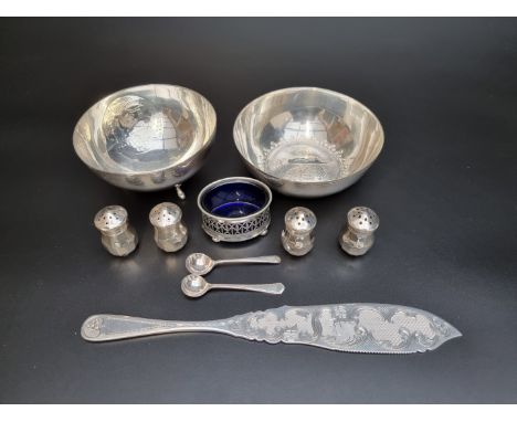 A set of four American pepperettes, stamped 'Lord Silver, Sterling', 39mm high; together with a silver salt; two silver spoon