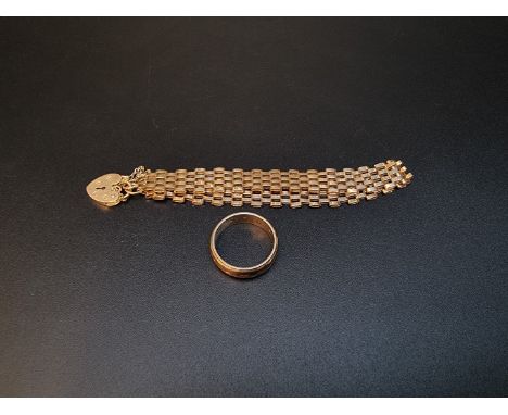 A 9ct gold gate bracelet; together with a 9ct gold gem set eternity ring, gross weight 9.2g. 