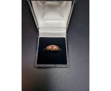 An 18ct gold ruby and diamond five stone ring, hallmarked 1919, size R, gross weight 3.2g. 