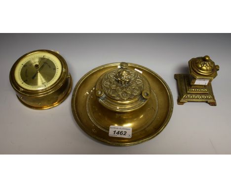 A Grand Tour type brass ink well; a smaller brass ink well, with brick design; a brass circular barometer (3)