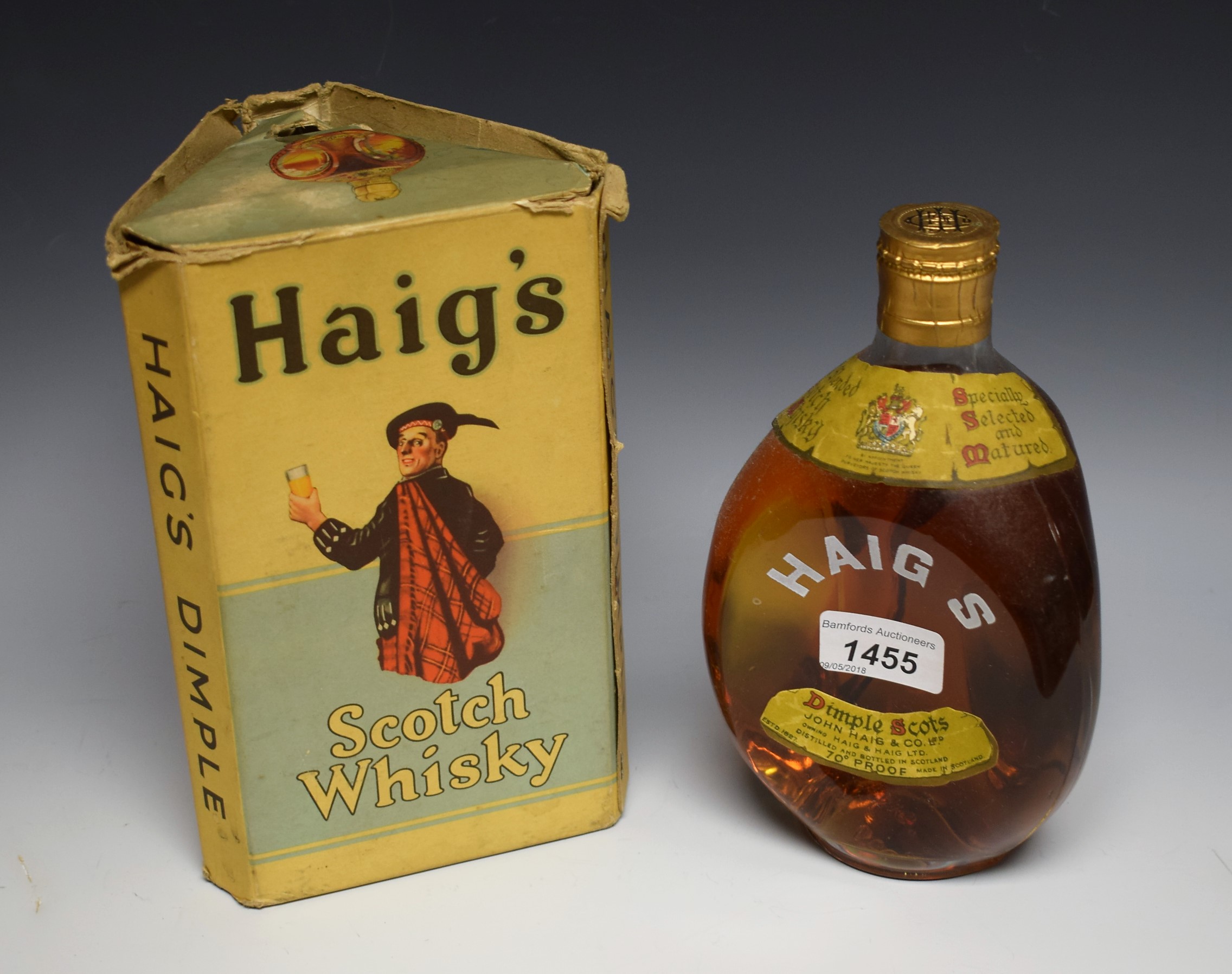 A 1940's bottle of Haig's Dimple Scots whisky with contents and
