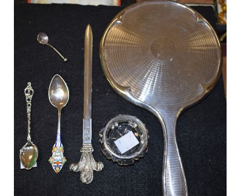 A silver paper knife, Prince of Wales Feathers terminal, Sheffield hallmark; a silver engine turned hand mirror, Birmingham 1