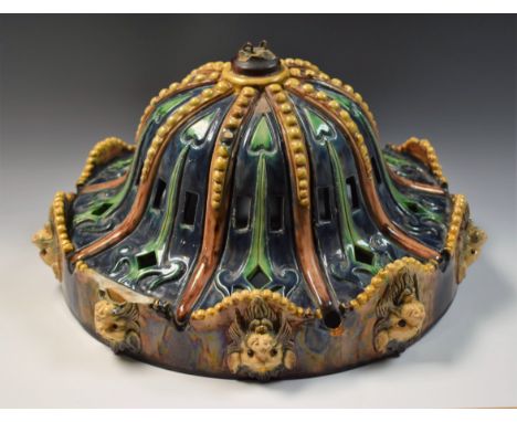 A Majolica ceiling light with lion mask rim