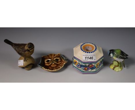 A Poole inkwell; Poole bird on a mushroom; a Wade dog; a Beswick bird (4)