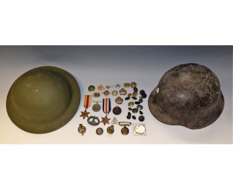 A collection of medals, medallions and World War items including German infantry steel helmet, British steel helmet; WWII gro