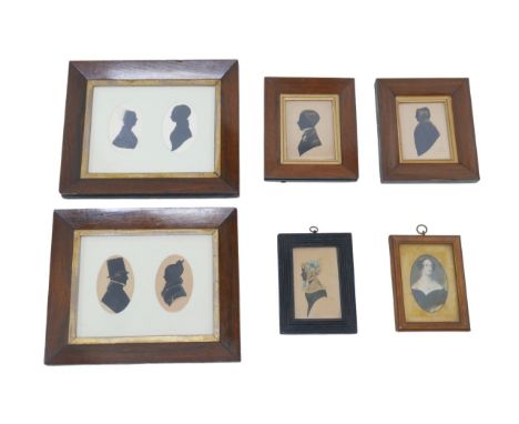 A group silhouette portraits of 19th century gentleman and ladies, including two portraits of couples, each mounted within th