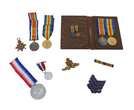 Two sets of WWI medals with recipients from the same family, comprising  a 1914-15 star, War medal and Victory medal for M2 0
