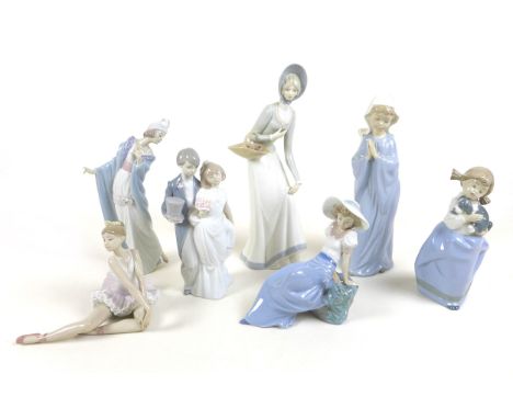 A collection of Lladro and Nao figurines, comprising 'Graceful Pose', boxed, 'Flirt', 'Wedding Bells', Prayer, two boxed Nao 