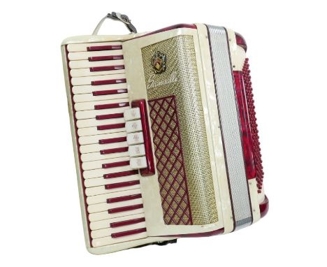 A Scandalli cased piano accordion, with original fitted case. 