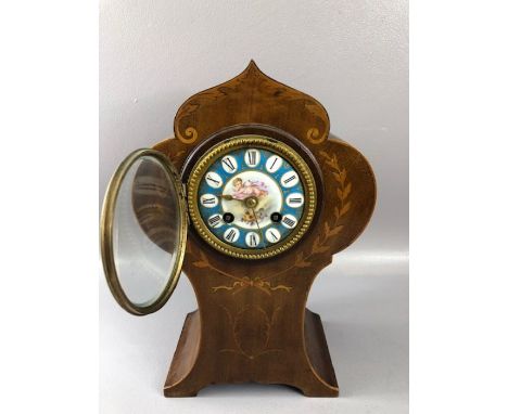 Antique mantle clock with inlay. Blue ground face Cupid decoration, approx  30cm tall winds and runs with bell strikes, pendu