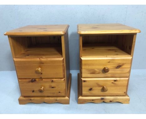 Pair of pine bedside cabinets each with shelf and two drawers