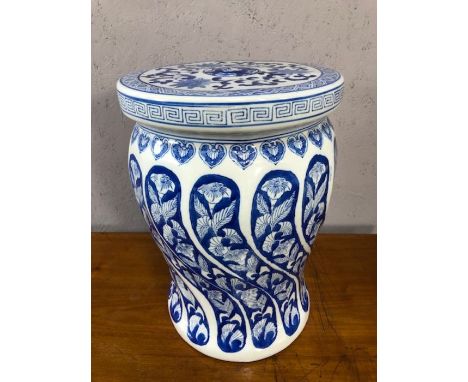 Ceramic blue and white Chinese garden seat or stool, decorated with flowers, approx 42cm tall