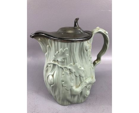 Antique ceramic Jug with Silver coloured hinged lid and Oak leaf decoration approx 21cm tall 