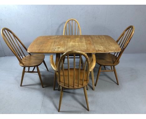 Drop leaf blond Ercol table and four Ercol chairs (one carver)