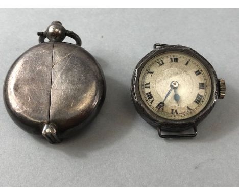 Silver circular pendant sovereign holder approx 30mm in diameter and a silver vintage wristwatch (A/F)