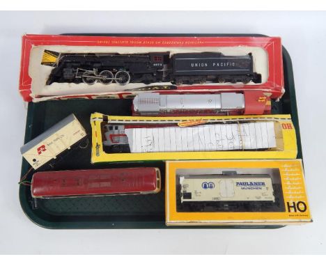 A Fleischmann SNLF electric locomotive, CL44101, boxed, a Deutsche Bahn diesel locomotive and attached goods wagon, a Herkat 