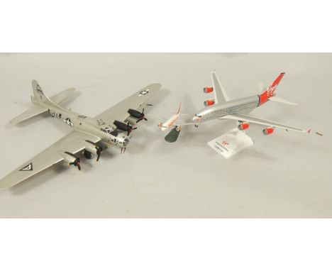 A Skymarks scale model of a Virgin Atlantic Airbus 380, 1:200 scale, on stand, an Easy Jet passenger plane, and a model of a 