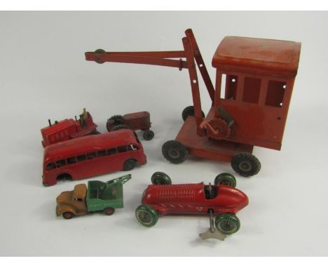 A Mettoy clockwork tin plate racing car, Dinky Heavy Tractor, Commer, Kondor Tractor, Mettoy bus and a Tri-ang crane, (6).
