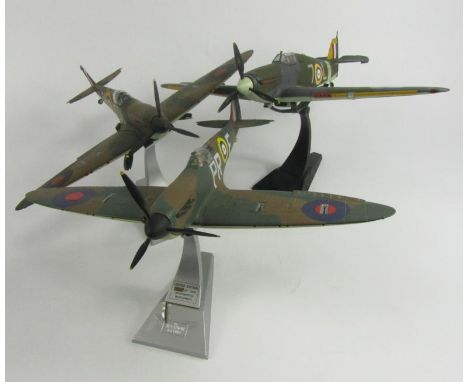 Corgi Aviation Archive Spitfire, further Spitfire and a Royal Navy Hurricane, on stands, one limited edition.