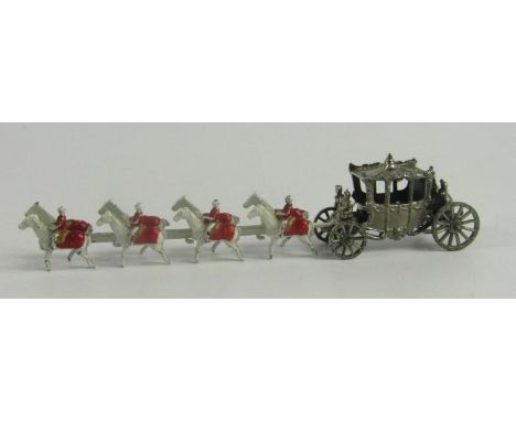 A miniature model of the Coronation State Coach, drawn by eight horses, 11.5cm long.
