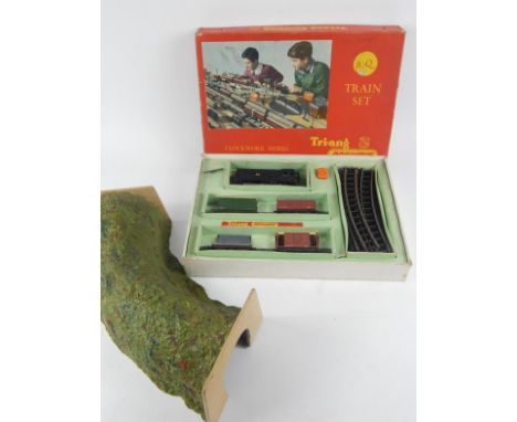 A Tri-Ang Railways OO-gauge clockwork model locomotive and tender set, no 13005, with track (boxed), and an associated tunnel