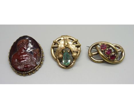 Three brooches; two vintage past set and one early celluloid 