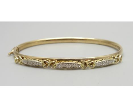 A 9ct gold and diamond set bangle, 6.8g 