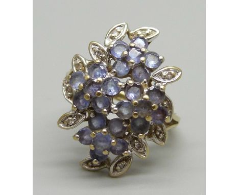 A 9ct gold diamond and tanzanite cluster ring, 3.2g, J 