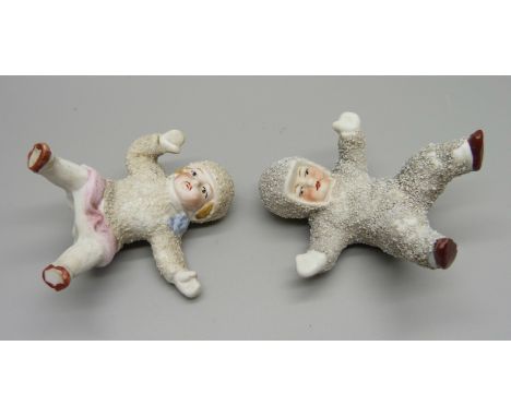 Two antique German bisque snow babies, boy and girl 