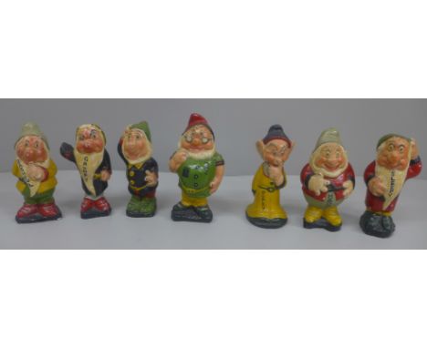 A set of vintage Seven Dwarfs figures, (Grumpy lacking arm, Dopey chipped), Doc 10cm 