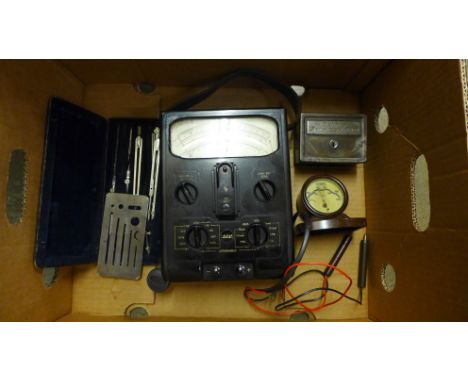 A Bank of British West Africa Ltd. money bank, a tub of coins, a technical drawing set, Rototherm barometer and a Selectest m