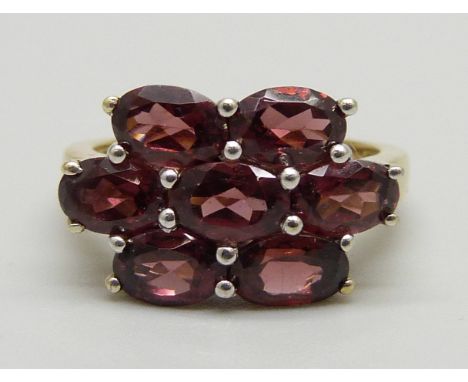 A silver gilt and almandine garnet cluster ring, L 