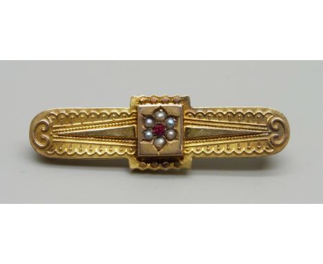 A Victorian 9ct gold, pearl and ruby brooch, Birmingham 1890, 2.3g with metal pin 