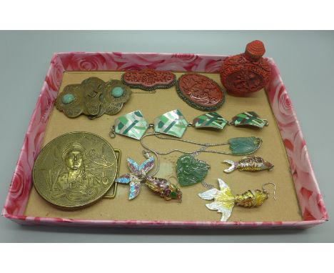 A collection of oriental jewellery including three enamelled articulated fish, carved jade pendants, a scent bottle, etc. 
