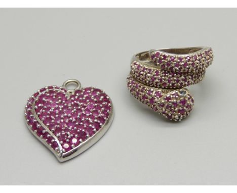 A silver and ruby snake ring and a similar heart shaped pendant, ring size P 