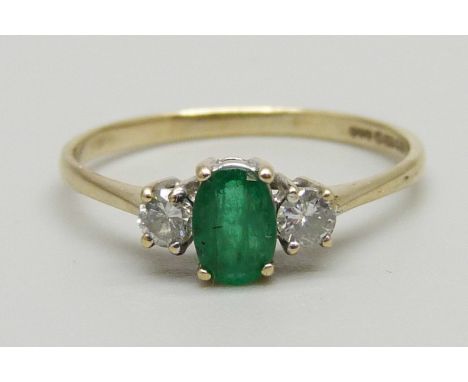 A 9ct gold diamond and emerald ring, 1.4g, Q 