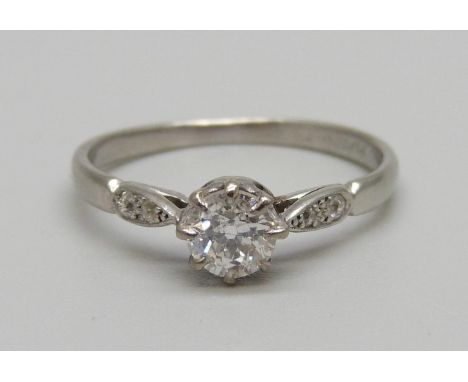 A platinum and diamond ring, main diamond approximately 0.55 carat weight, 3.1g, R 