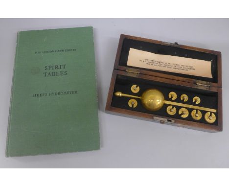 A Sikes hydrometer, boxed, with book 