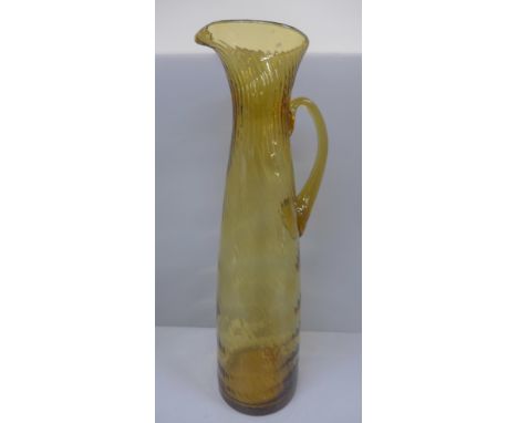 A Whitefriars glass tall golden amber jug or pitcher, 44cm 