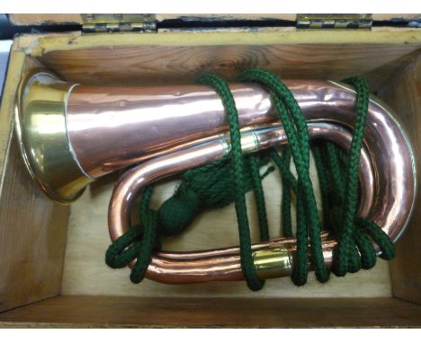 A copper and brass trim bugle, boxed 
