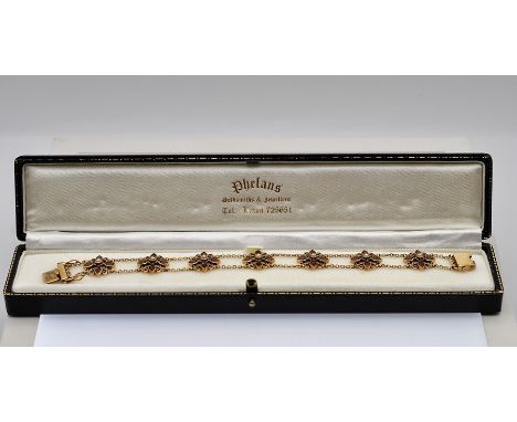 A fine 9ct. gold garnet and sea pearl bracelet, length 7 1/4inches (18.5cm) gross weight 11.9 grams 