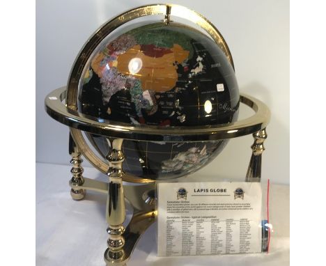 A Lapis Gemstone Globe, 330mm diameter, in a rotating cradle with four sculptured legs and central compass, with valuation an