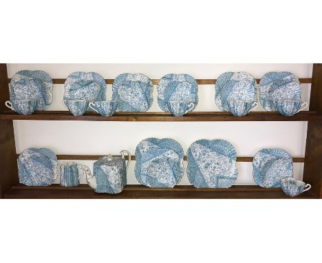 A quantity of Wileman &amp; Co tea service including 7 cups, 9 saucers and plates, milk jug, 2 large plates, teapot and jug. 