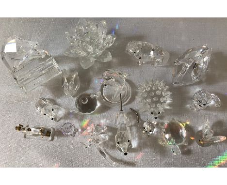 Swarovski crystal glass models (17) including grand piano + stool, sewing machine, teapot x 2, swan, cats x 2, wolf, dolphins