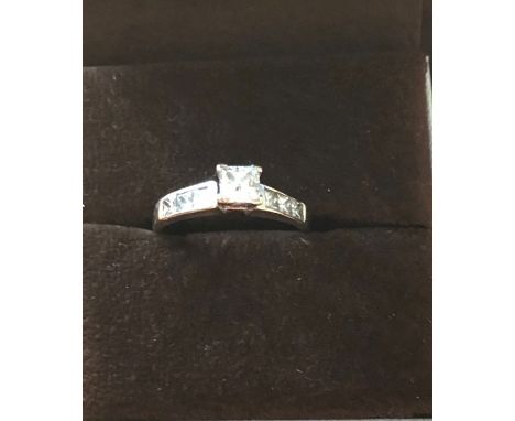 An 18ct white gold and diamond solitaire ring size R