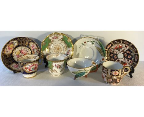 Four cups and saucers  including Royal Crown Derby, Coalport etc.